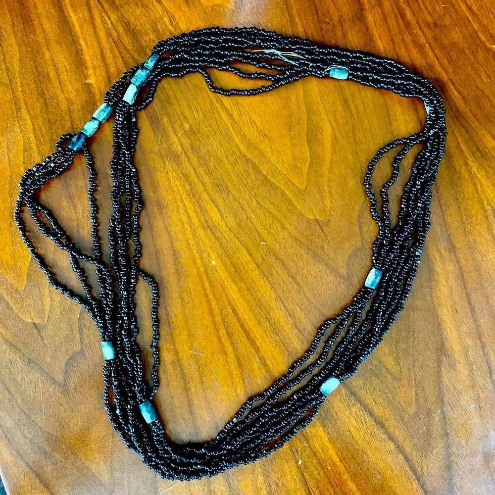 Black beaded necklace. Long and can be wrapped many times.